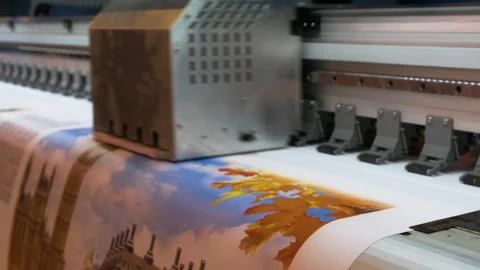 A printer is printing a picture of a leafy tree with a blue sky in the backgr Stock Footage 274127406