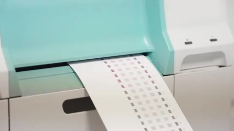 A printer is printing a white sheet of paper with a grid pattern on it Video stock 274481779
