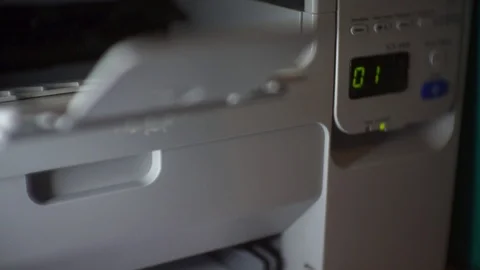 Printer prints in beautiful rays of light close-up Stock Footage 123744089