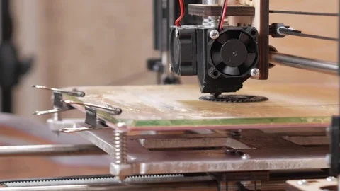 The printer prints the gear. A layer by layer appears on the desktop Stock Footage 77952031