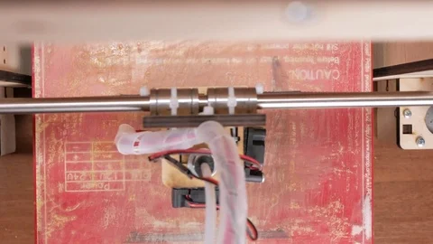 The printer prints the gear. A layer by layer appears on the desktop Stock Footage 77954956