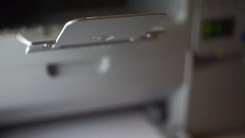 Printer prints in romantic rays of light close-up Stock Footage 123744121