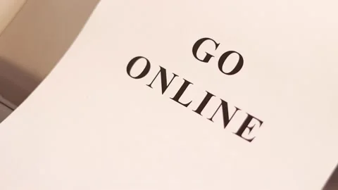 Printer prints the sheet of paper with "Go online" text Vídeo Stock 136260983