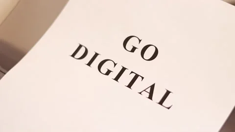 Printer prints the sheet of paper with text "GO DIGITAL" Stock Footage 140934005