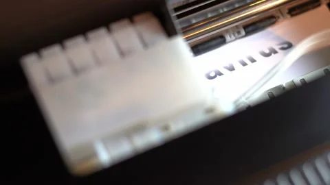 The printer prints the title of the article about the coronavirus on a white Stock Footage 157479325