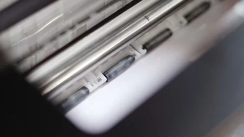 Printer prints on white glossy paper close-up Stock Footage 157096090