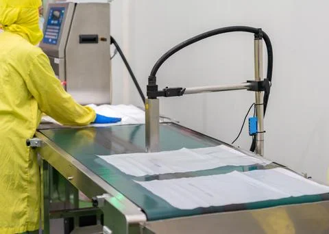 Printer production date, code, Lot No. to packaging bag. Stock Photos