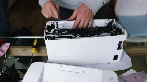 Printer repairman inspecting printer interior. Concept of professional printer Stock Footage 289773715
