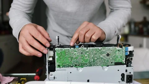 Printer repairman inspecting printer interior. Concept of professional printer Stock Footage 289773760