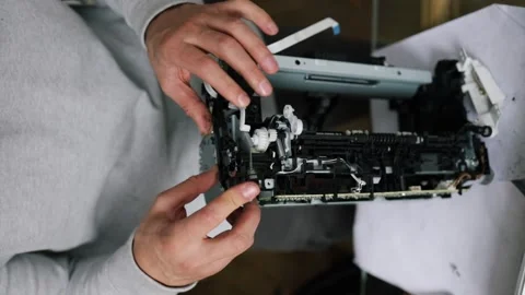Printer repairman inspecting printer interior. Concept of professional printer Stock Footage 289773837