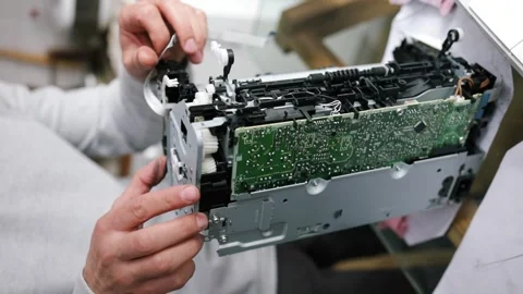 Printer repairman inspecting printer interior. Concept of professional printer Stock Footage 289773929