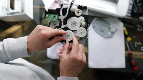 Printer repairman inspecting printer interior. Concept of professional printer Stock Footage 289773946