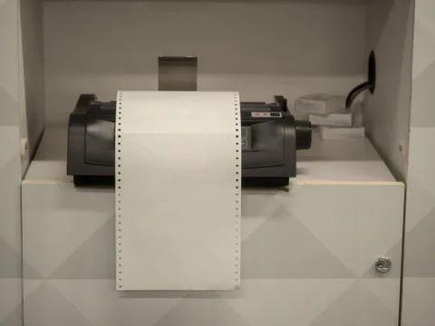 Printer sitting on shelf with overflowing blank white paper Stock Photos