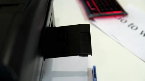 The printer on the table printed a smiley face with a tongue on a piece of paper Stock Footage 146318146