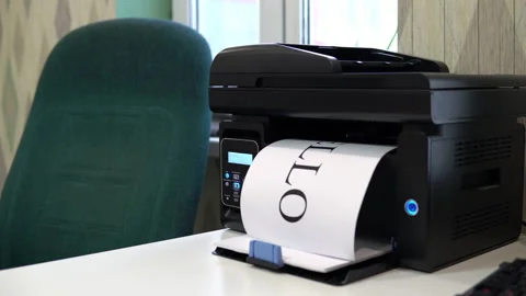 The printer on the table typed a word hello on a piece of paper. Office space Stock Footage 146316424