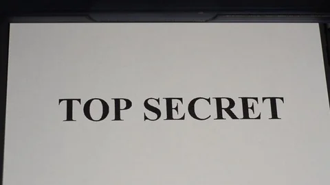 The printer on a white sheet of paper prints the top secret Video stock 123352423