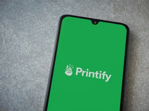 Printify app launch screen on smartphone on ceramic stone background Stock Photos
