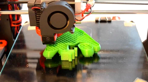 Printing 3D printer on black glass surface closeup Stock Footage 68903556