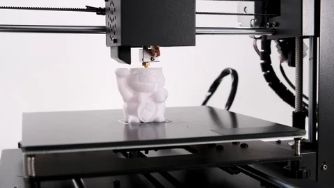 Printing on 3D printer cat toy figurines from white plastic close-up. Stock Footage 105268875