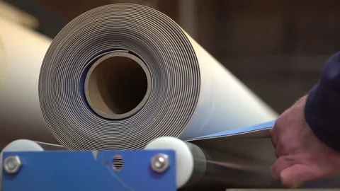Printing Blanket - Rolling the Blanket out for Cutting Stock Footage 76863317