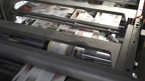 Printing of coloured newspapers with an offset printing machine at a printing Stock Footage 98226780