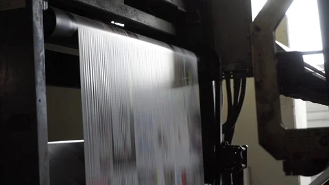 Printing of coloured newspapers with an offset printing machine at a printing Stock Footage 98226861