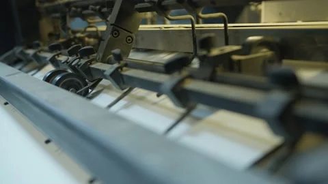 Printing of coloured newspapers with an offset printing machine at a printing Stock Footage 184844084