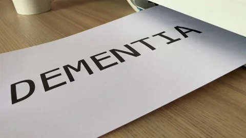 Printing “DEMENTIA” text written message word on paper sheet A4 document Stock Footage 181137398