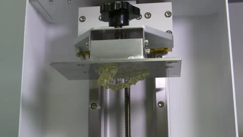 Printing of dental crowns on a 3D printer. Ceramic dental crowns for implants. Stock-Footage 256580777