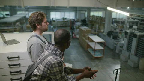 Printing Factory Technicians Overlooking Production Floor from Mezzanine Video stock 335487068