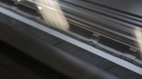 Printing head creates image on paper in machine. printer for printing large form Stock-Footage 98859327