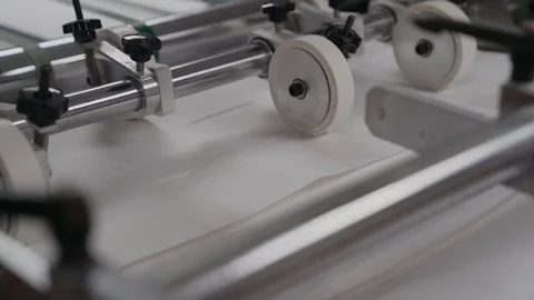 Printing house cut sheets of paper go on the conveyor. Detail of Modern Printing Stock Footage 129361872