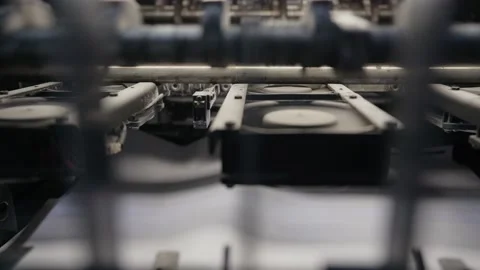 Printing house machine rotates over printed newspaper Stock-Footage 145464620