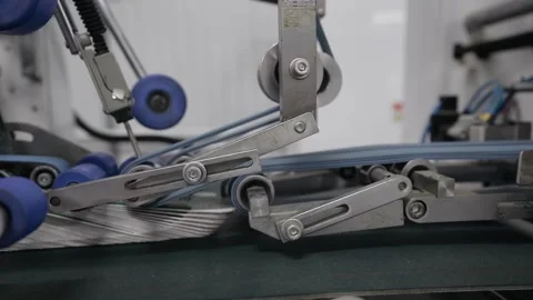 Printing house. Printed sheets of paper are fed to the printing press. Offset Stock Footage 153494244