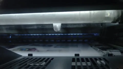 Printing house. Printed sheets of paper are fed to the printing press. Offset Stock Footage 185915081