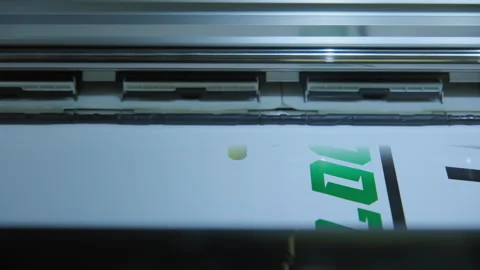 Printing on image on a technological printer. Close up shot of printer head Stock Footage 263499556