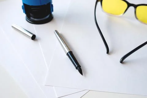 Printing on the impression on the table with paper and other office accessori Stock Photos