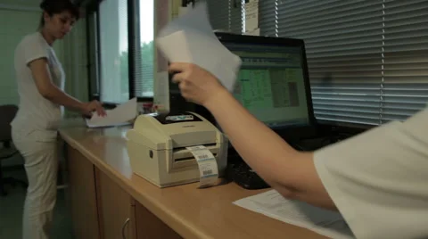 Printing lab results with bar code, close up. Medical technician writes results. Vídeo Stock 52283907