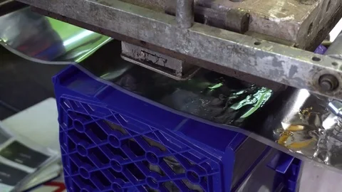 Printing machine makes a logo on a plastic box Stock Footage 76900498