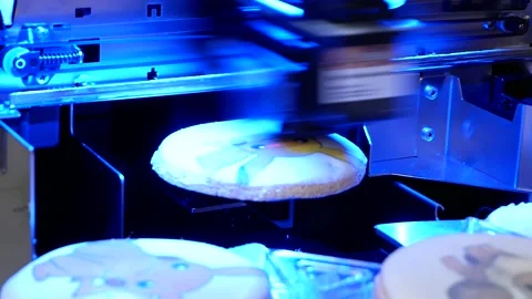 The printing plotter creates a pattern on the cookies Stock Footage 190407881