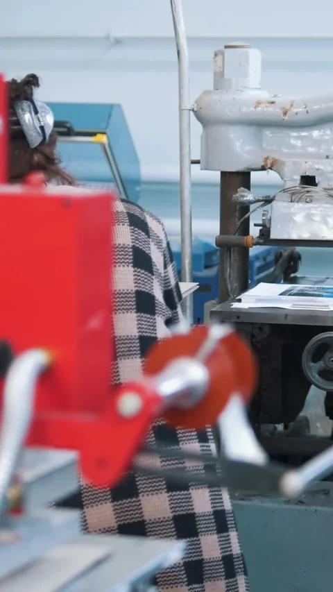 Printing press equipment in front of people working in typography Stock Footage 346707199