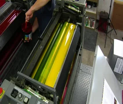 Printing press is loaded with red ink Stock Footage 21596520
