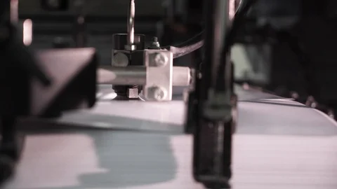 The printing press is loaded with work in the printing house. from the printing Stock Footage 97299638