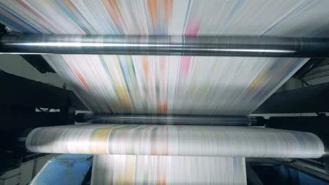 Printing press releasing solid piece of coloured paper Stock Footage 111360753