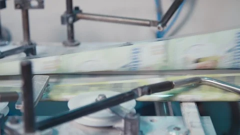 Printing press working at high speed in a large printing facility Stock Footage 91299615