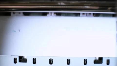 Printing process of color inkjet printer close-up. The rolles is rolling inside Stock Footage 314462348