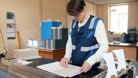Printing process - feeding sheets of paper, polygraph industry, wide angle Stock Footage 76934292