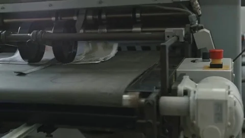 Printing Process on polygraph industry - brochures moving on the conveyor belt Stock Footage 69111948