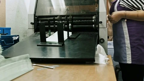 Printing Process on polygraph industry - brochures moving on the conveyor belt Stock Footage 74206085