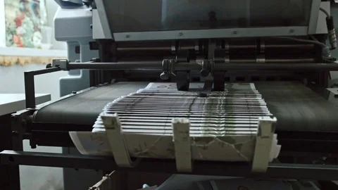 Printing Process on polygraph industry - brochures moving on the conveyor belt Stock Footage 74417530